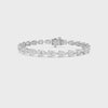 Video showcasing a 14KT white gold lab-grown pear diamond tennis bracelet, highlighting its diamond arrangement, setting, and clasp.